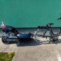 Black bike with central motor + electric trailer
