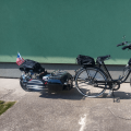 Black bike with front motor + electric trailer